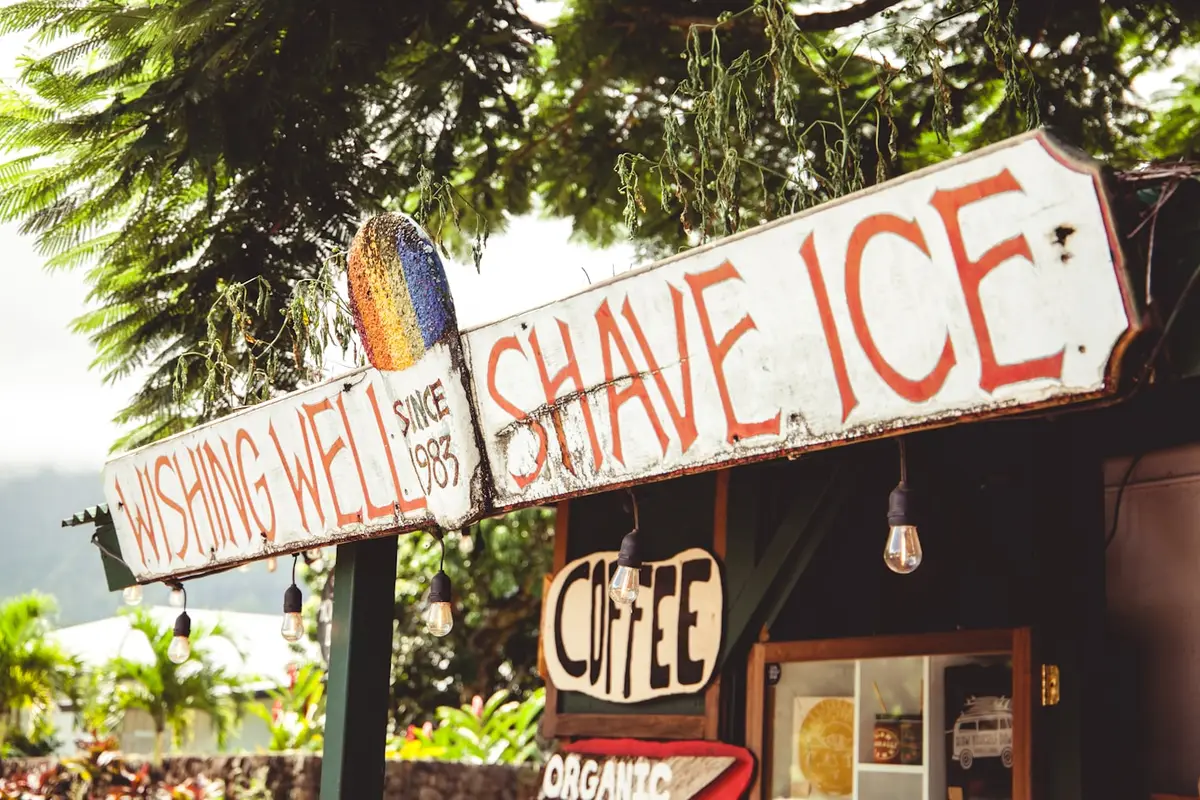 Wishing Well Shave Ice, a hand painted roadside sign in Hanalei on Kauai's north shore