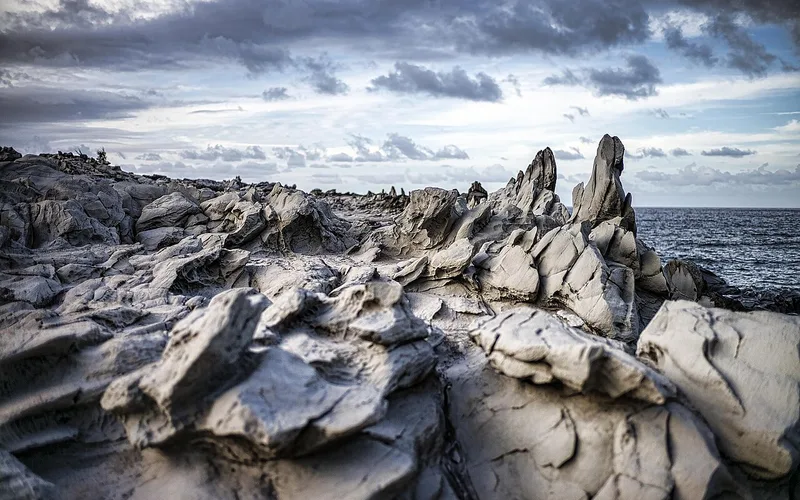 Dragons Teeth Maui, the jagged wave carved lava spikes of Makaluapuna Point in Kapalua with the ocean behind