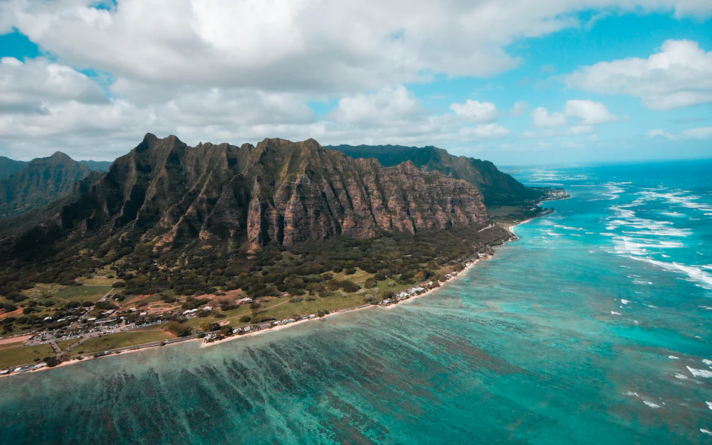 An aerial view of a Hawaiian island ringed by the ocean