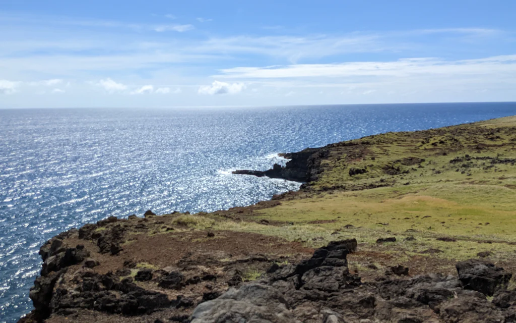 Grassy sea cliffs and open ocean along the Kahekili Highway on Maui's north coast
