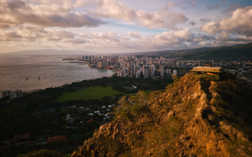 Golden hour view of Honolulu and the south shore from the Diamond Head ridge that rises beside the Kaimuki neighborhood