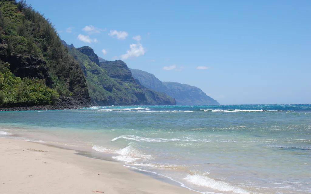 Ke'e Beach, Kauai, with its green mountain backdrop at the end of the north shore road