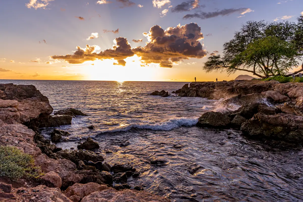 Golden hour sunset over the rocky shore at Ko Olina on Oahu's west side