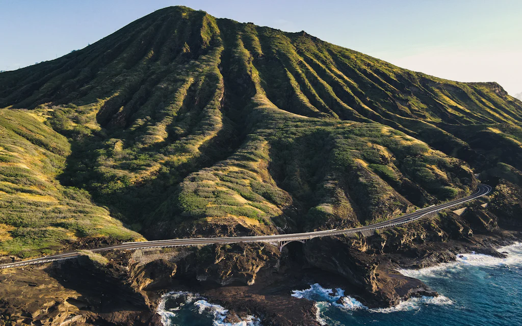 The green Koko Head crater rising above the southeast Oahu coastline and ocean
