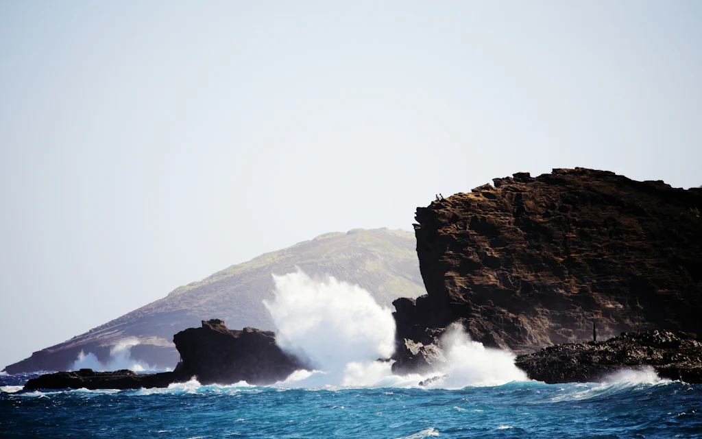 Waves exploding against the lava-rock headland at Nakalele Point on Maui's wild north coast